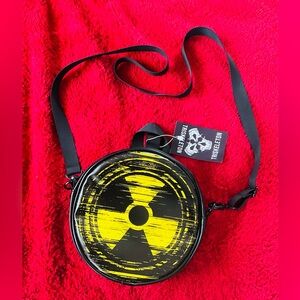 Triskelion Round Crossbody Bag with Yellow Radiation Graphic